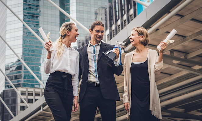 Three team members encouraging each other and building middle ground for optimal performance.