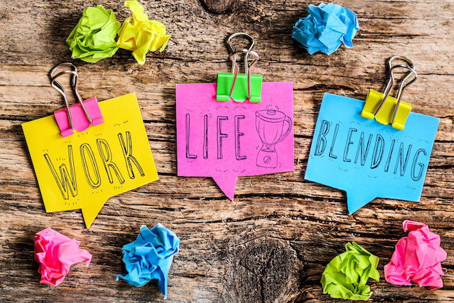 Work life blending on colorful post-it notes with colorful clips on a piece of wood and surrounded by other crumpled paper