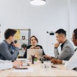 Boss engaging with her diverse business team in an office