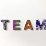 Colorful block letters spelling out the word TEAM.