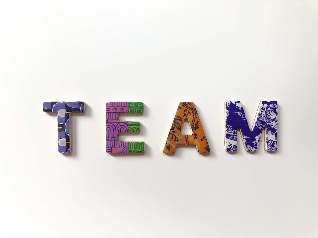 Colorful block letters spelling out the word TEAM.