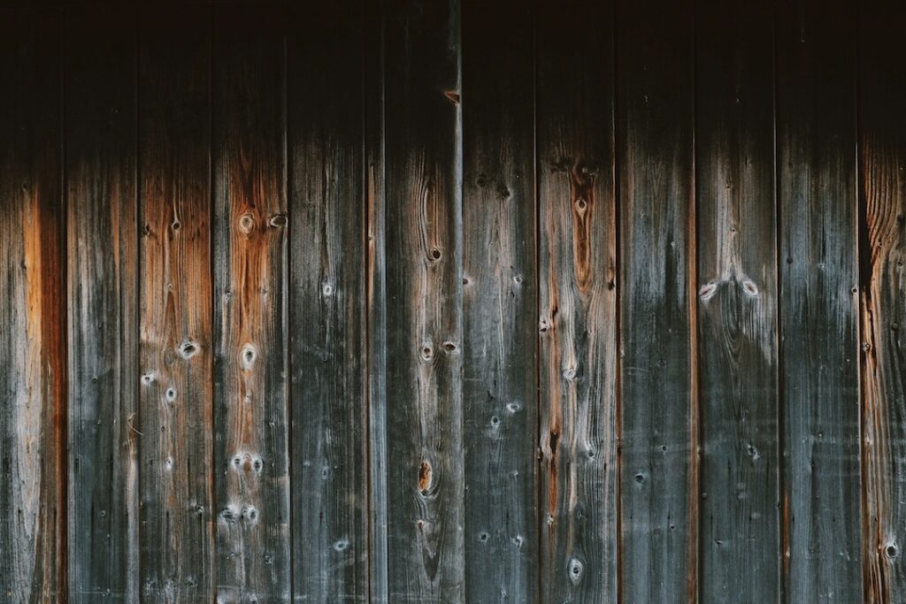 Old barn wall with many knicks and scrapes.